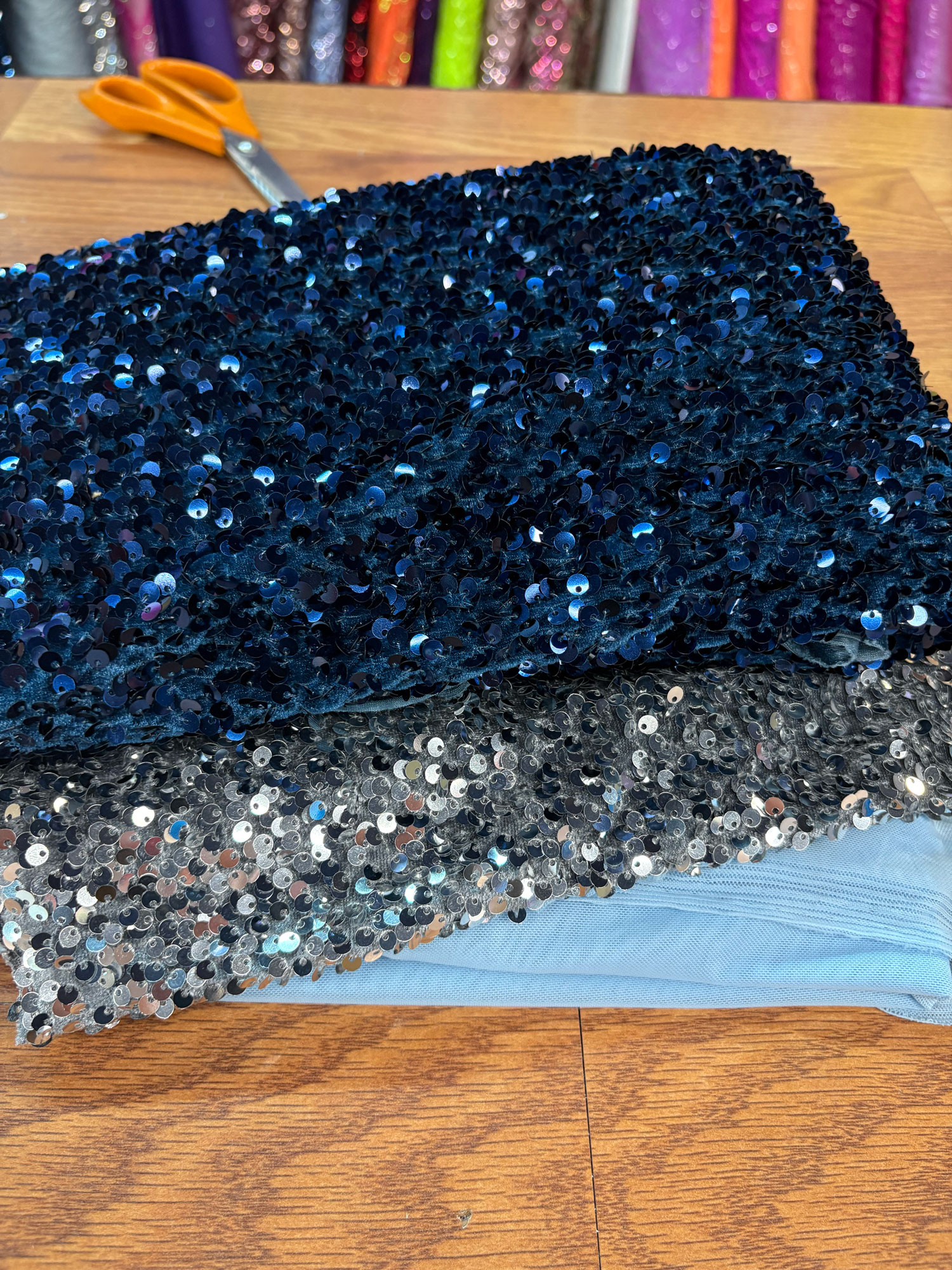 Fabric swatches including sequins and spandex